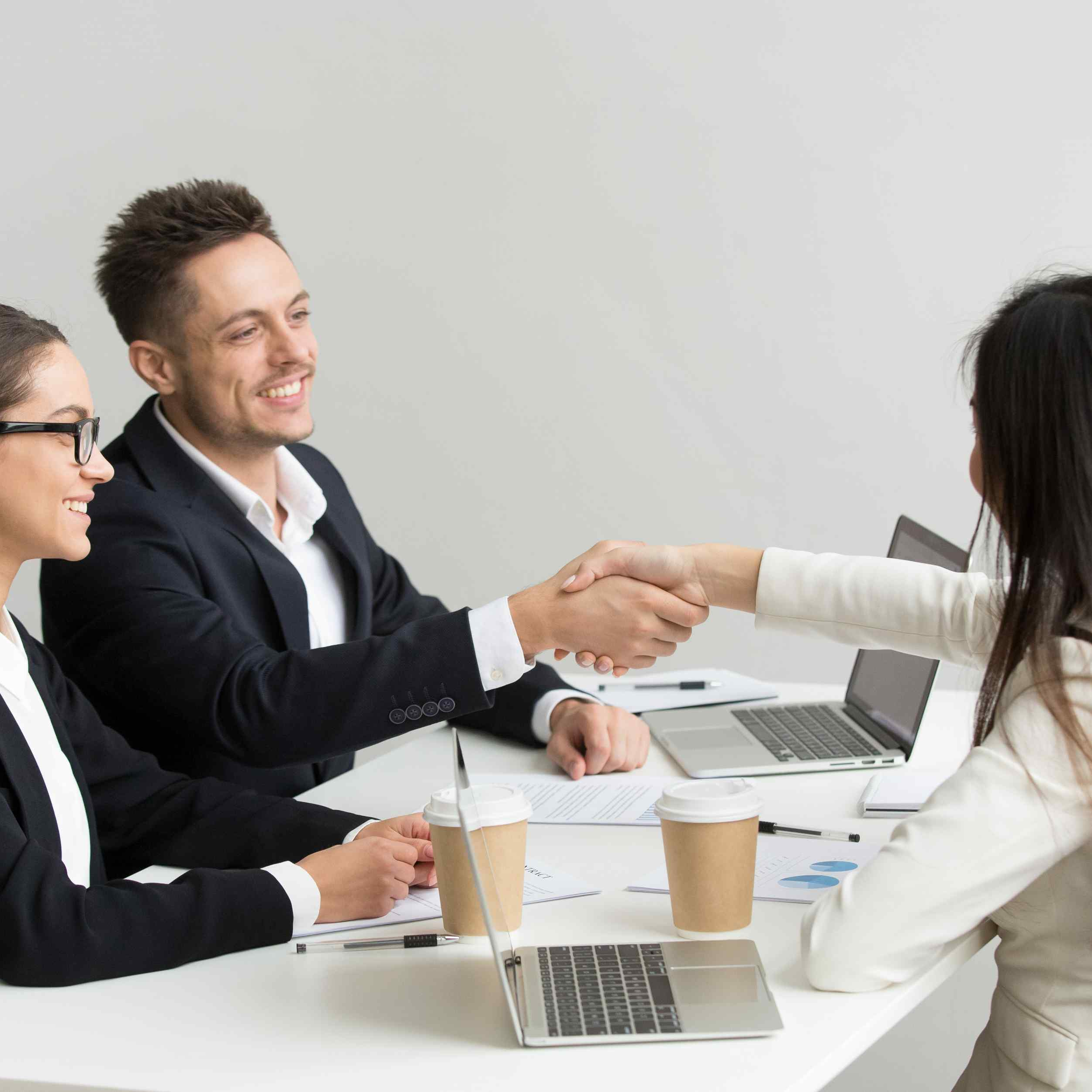 friendly-partners-handshaking-group-meeting-thanking-successful-teamwork.jpg